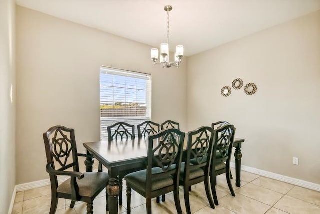 dining room with an inviting chandelier and light tile patterned flooring