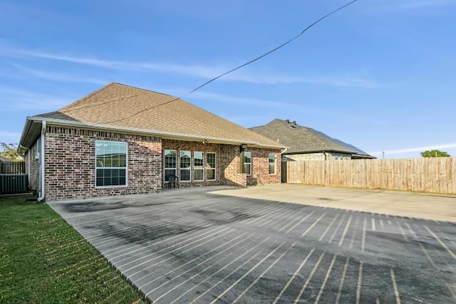 back of house featuring central AC unit and a patio area