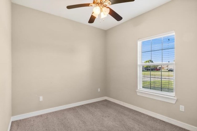 spare room with light carpet and ceiling fan