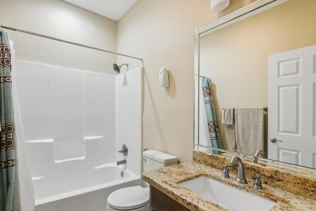 full bathroom featuring vanity, bathtub / shower combination, and toilet