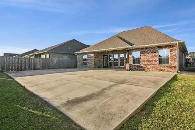 back of house with a yard