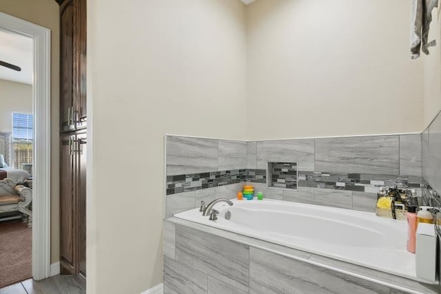 bathroom with tiled tub