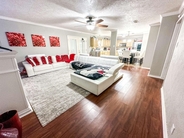 671 Birchwood Dr, Port Neches, TX 77651 - living area featuring a ceiling fan, ornamental molding, dark wood-type flooring, and a textured ceiling