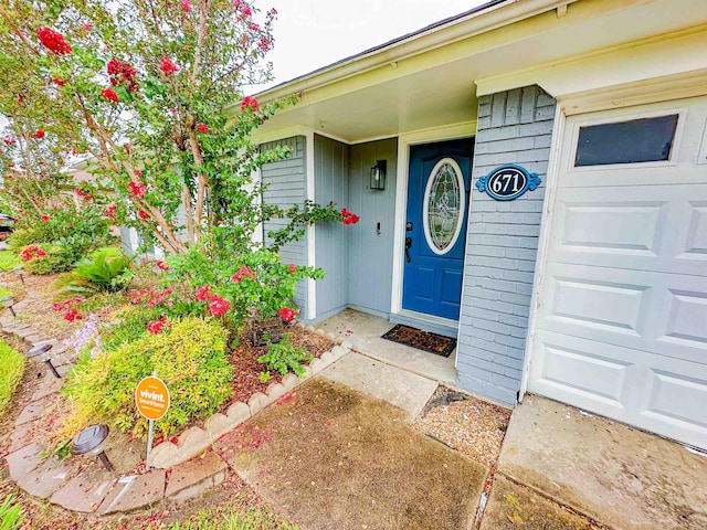 671 Birchwood Dr, Port Neches, TX 77651 - property entrance featuring an attached garage