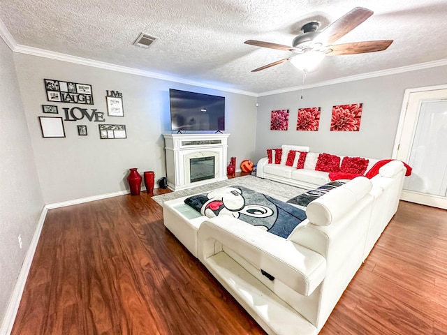 671 Birchwood Dr, Port Neches, TX 77651 - living room with wood finished floors, ceiling fan, ornamental molding, a textured ceiling, and baseboards