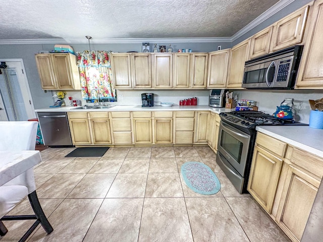 671 Birchwood Dr, Port Neches, TX 77651 - kitchen featuring stainless steel appliances, a sink, light countertops, light brown cabinetry, and ornamental molding