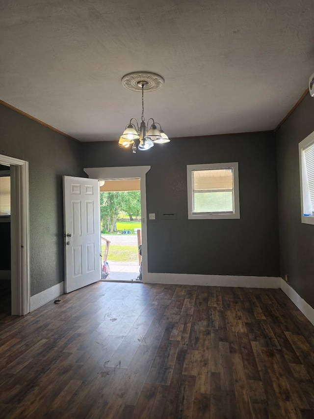 936 9th St, Port Arthur, TX 77640 - foyer entrance featuring dark wood-type flooring and a chandelier