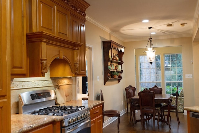 kitchen with hanging light fixtures, stainless steel gas range oven, tasteful backsplash, and ornamental molding