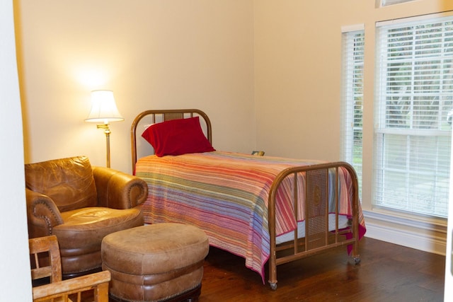 bedroom featuring dark hardwood / wood-style flooring