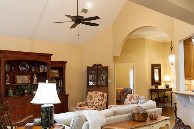 living room with vaulted ceiling, ceiling fan, and dark wood-type flooring