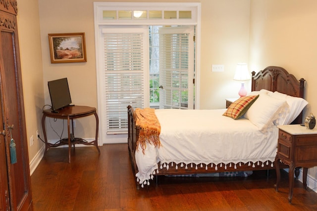 bedroom with dark wood-type flooring