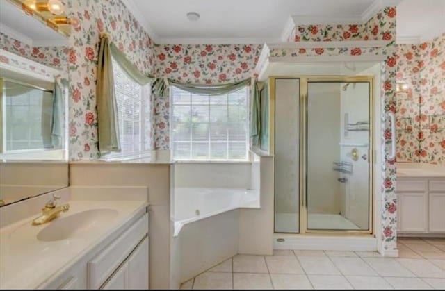 full bath with a stall shower, two vanities, a sink, and wallpapered walls