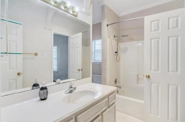 bathroom featuring shower / tub combination, vanity, and crown molding