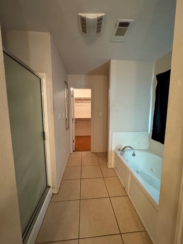 bathroom with tile patterned flooring and plus walk in shower