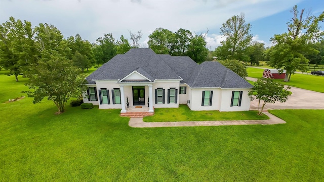 5065 Turner Rd, Orange, TX 77630 - view of front of home featuring a front lawn, stucco siding, french doors, and a shingled roof