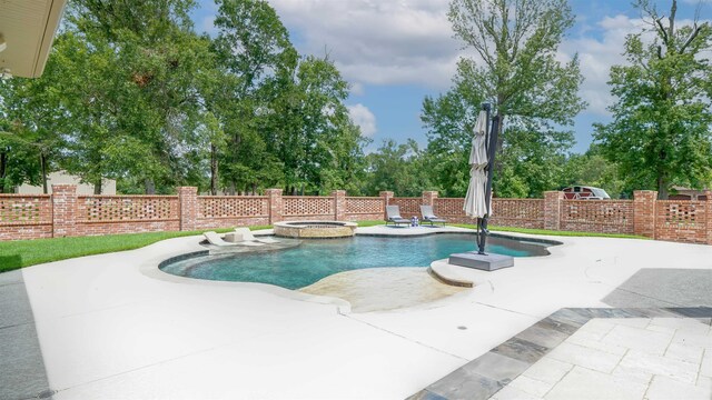 5065 Turner Rd, Orange, TX 77630 - view of swimming pool featuring a fenced backyard, a patio area, a pool with connected hot tub, and view of wooded area