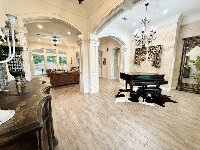 5065 Turner Rd, Orange, TX 77630 - dining space featuring arched walkways, decorative columns, ceiling fan, light wood-style flooring, and ornamental molding