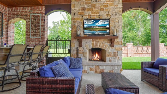 5065 Turner Rd, Orange, TX 77630 - view of patio / terrace with an outdoor living space with a fireplace