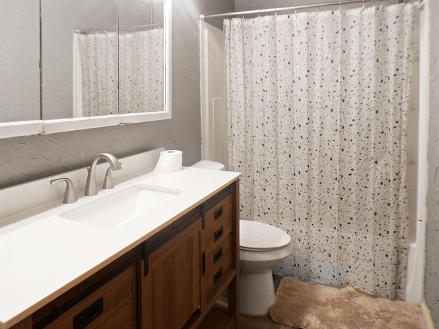 full bathroom featuring shower / bath combination with curtain, toilet, and vanity