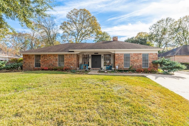 ranch-style home featuring a front yard