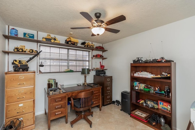 office space with ceiling fan and a textured ceiling