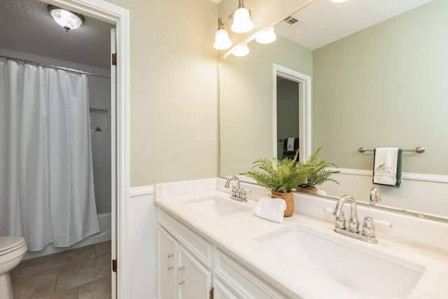 full bathroom featuring toilet, vanity, and shower / bathtub combination with curtain