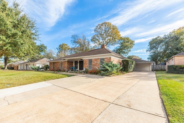 single story home featuring a front yard and a garage