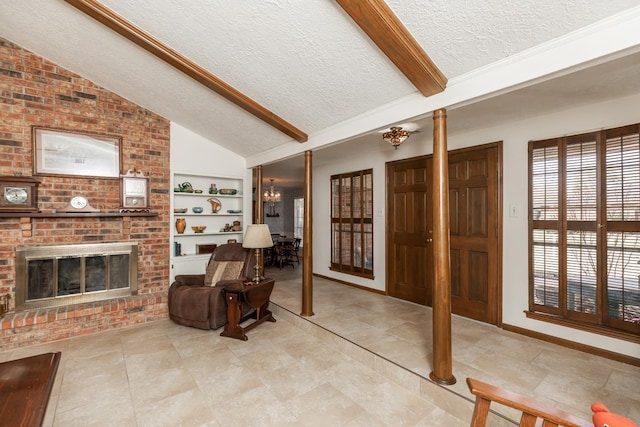 interior space featuring a brick fireplace, a textured ceiling, lofted ceiling with beams, and a chandelier