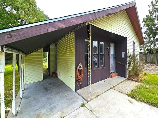 exterior space featuring a carport