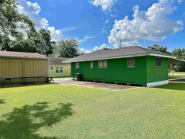 2349 Amino St, Port Arthur, TX 77640 - back of house featuring a lawn