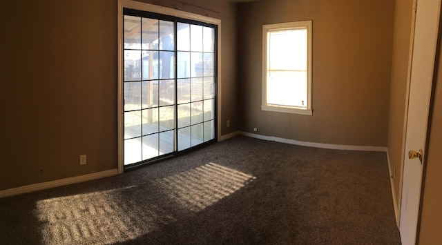 2333 1st St, Port Neches, TX 77651 - unfurnished room featuring dark carpet and plenty of natural light