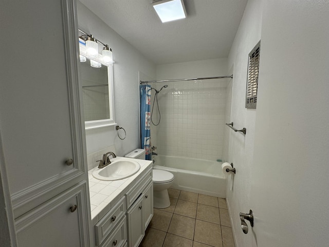 full bathroom with shower / bath combo, tile patterned flooring, a textured ceiling, toilet, and vanity