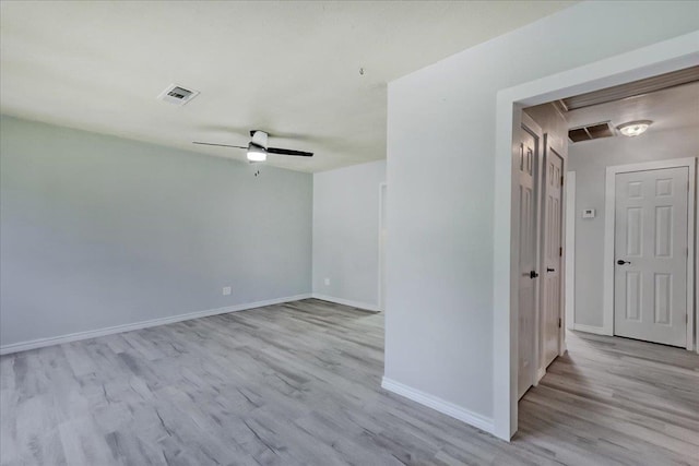 2125 10th St, Port Neches, TX 77651 - unfurnished room with light wood-type flooring, baseboards, and ceiling fan