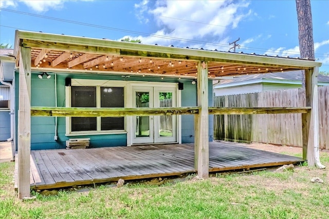 2125 10th St, Port Neches, TX 77651 - rear view of property with french doors, fence, and a deck