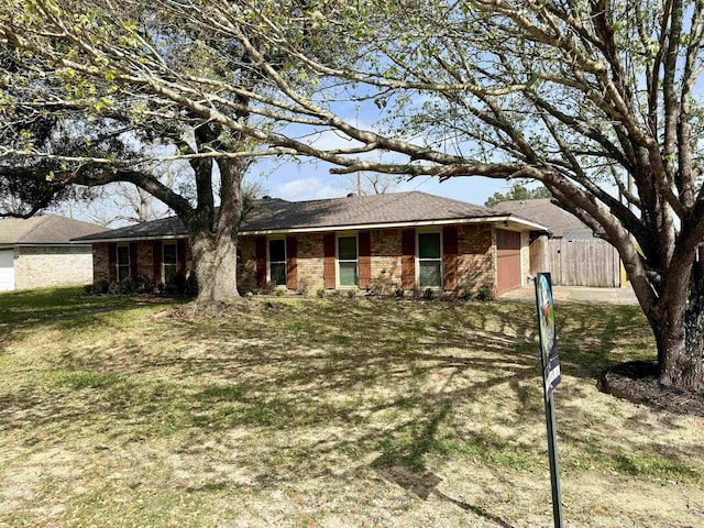 ranch-style home with a gate, fence, and a garage