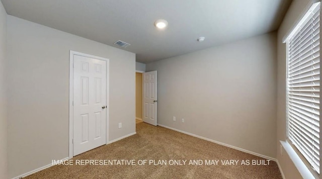 1690 Haidlyns Way, Sour Lake, TX 77659 - unfurnished bedroom featuring carpet floors and baseboards