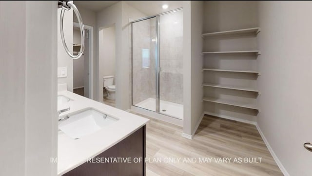 1690 Haidlyns Way, Sour Lake, TX 77659 - full bathroom featuring toilet, double vanity, a shower stall, and wood finished floors