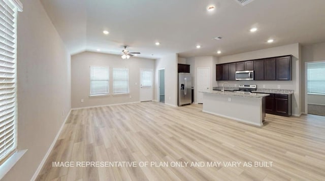 1690 Haidlyns Way, Sour Lake, TX 77659 - kitchen with appliances with stainless steel finishes, a sink, open floor plan, recessed lighting, and ceiling fan
