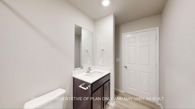 1690 Haidlyns Way, Sour Lake, TX 77659 - half bathroom featuring vanity, toilet, and baseboards