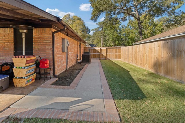 view of yard with central AC unit