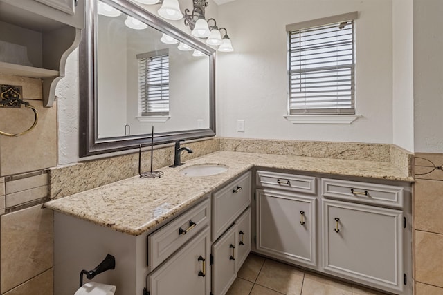 bathroom with tile patterned floors and vanity