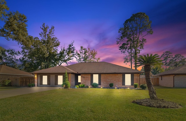 view of front of property with a yard