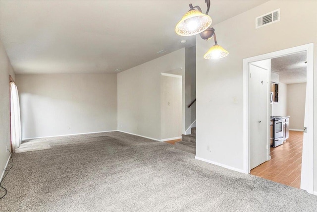 unfurnished living room with carpet