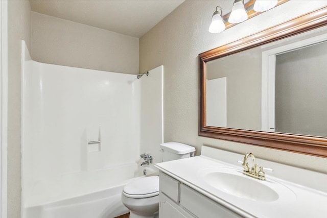 full bathroom featuring shower / washtub combination, vanity, and toilet