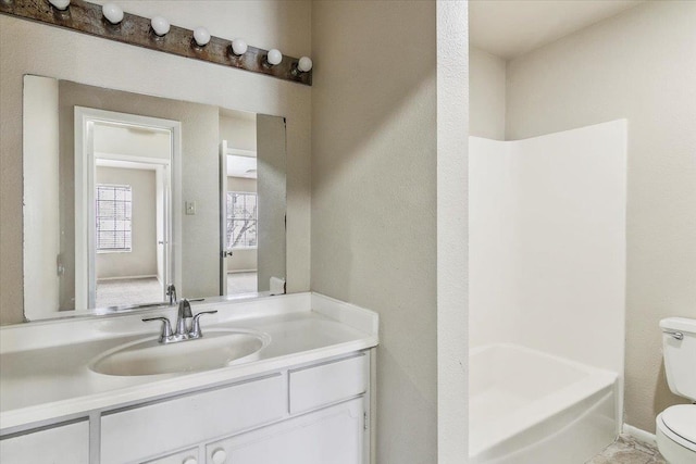 full bathroom with vanity,  shower combination, and toilet