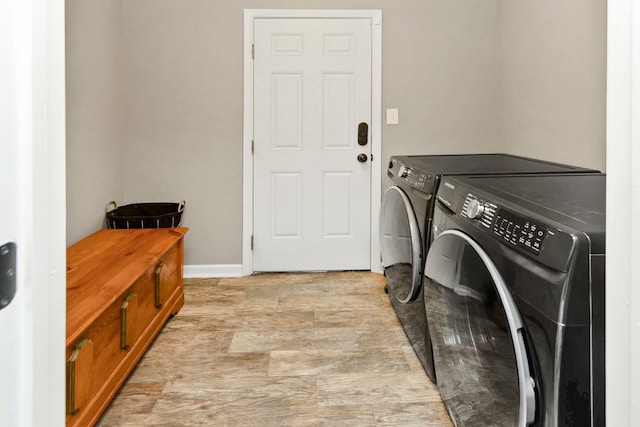 clothes washing area with independent washer and dryer