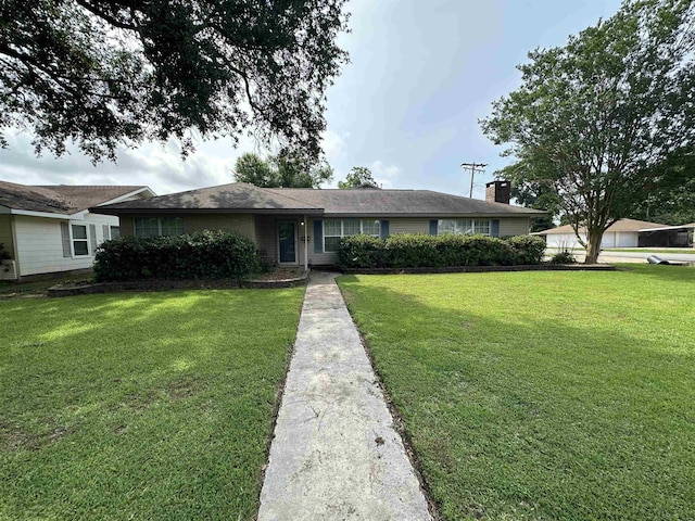 ranch-style home with a front lawn