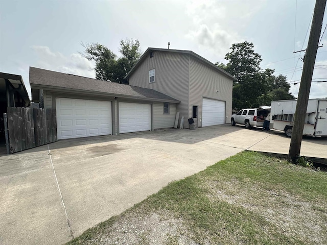 view of side of property featuring a garage