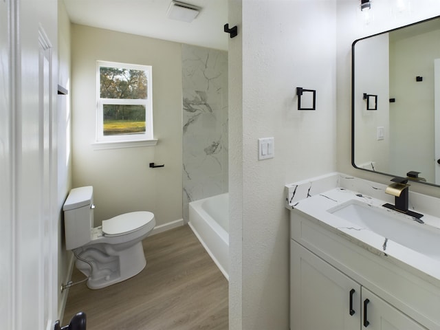 5260 Landry Ln, Beaumont, TX 77708 - bathroom with toilet, visible vents, baseboards, wood finished floors, and vanity