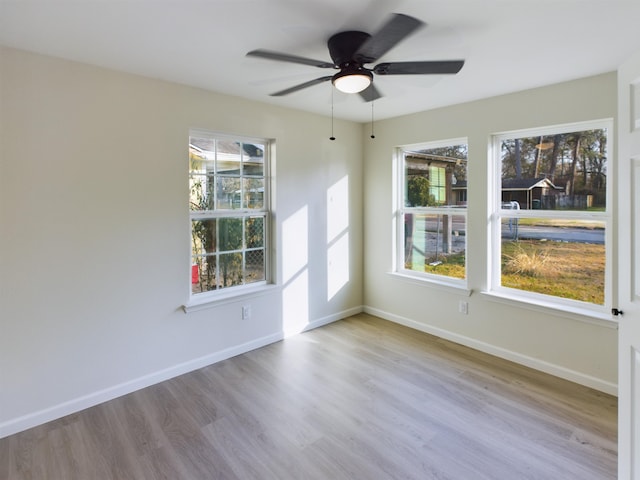 5260 Landry Ln, Beaumont, TX 77708 - empty room with wood finished floors, baseboards, and ceiling fan